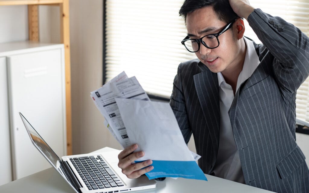 man wearing glasses looking stressed